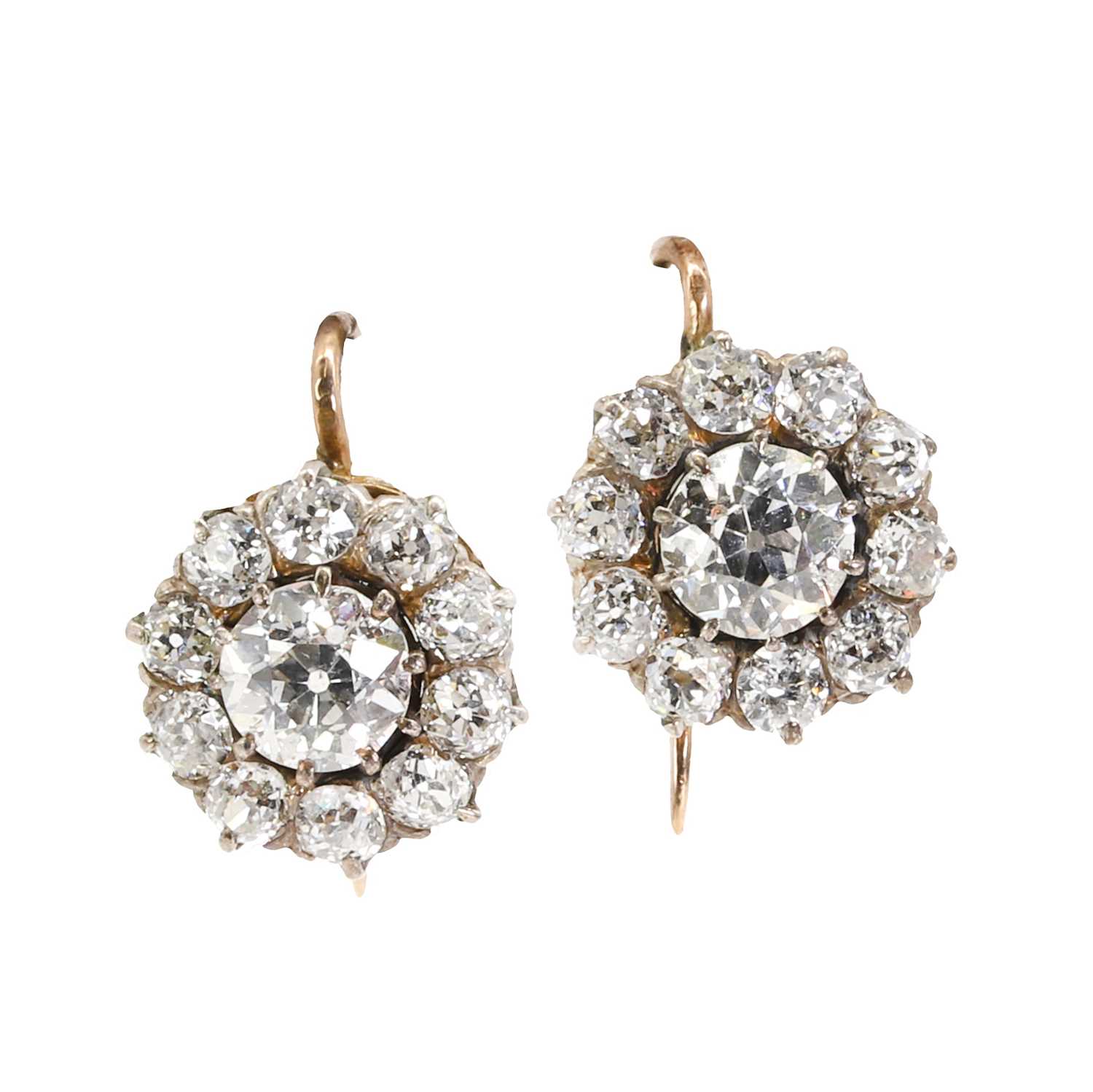 A pair of diamond daisy cluster earrings, c.1890,
