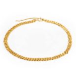 A textured gold choker necklace,