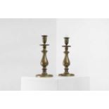 A pair of brass candlesticks,