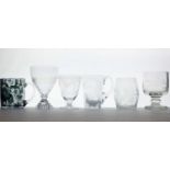 A group of six drinking glasses