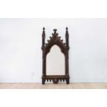 A Gothic Revival carved oak pier mirror,