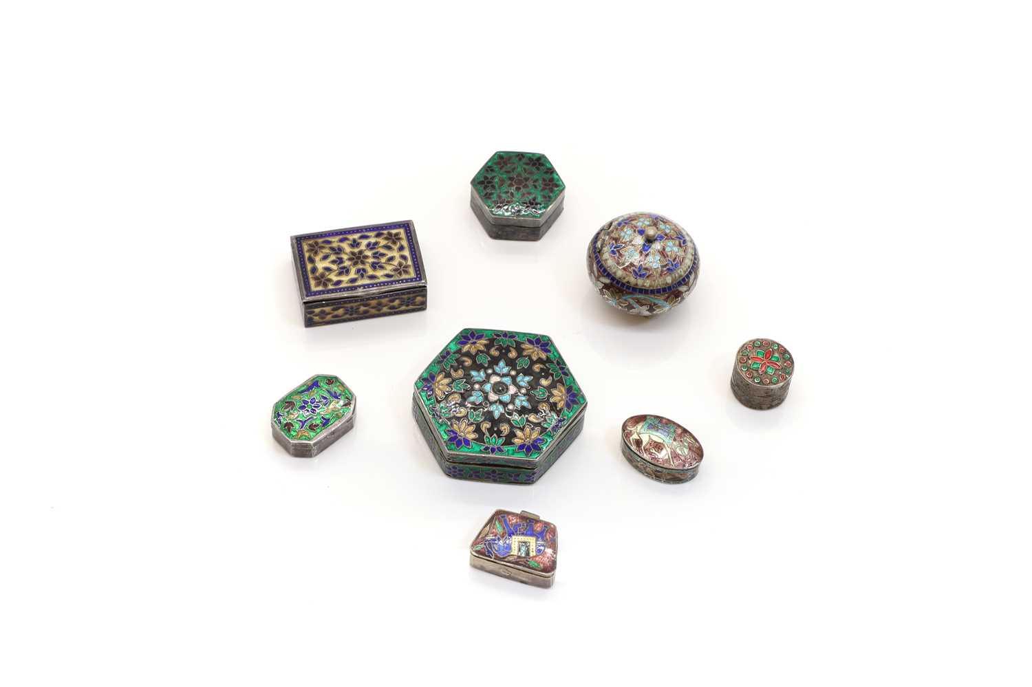 A group of silver and enamel boxes