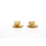 A pair of Chinese agate cups and saucers,