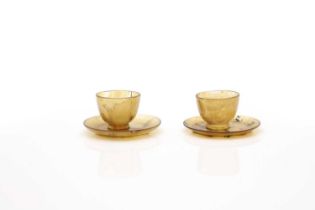 A pair of Chinese agate cups and saucers,