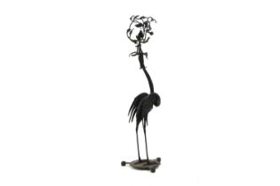 A patinated metal stork