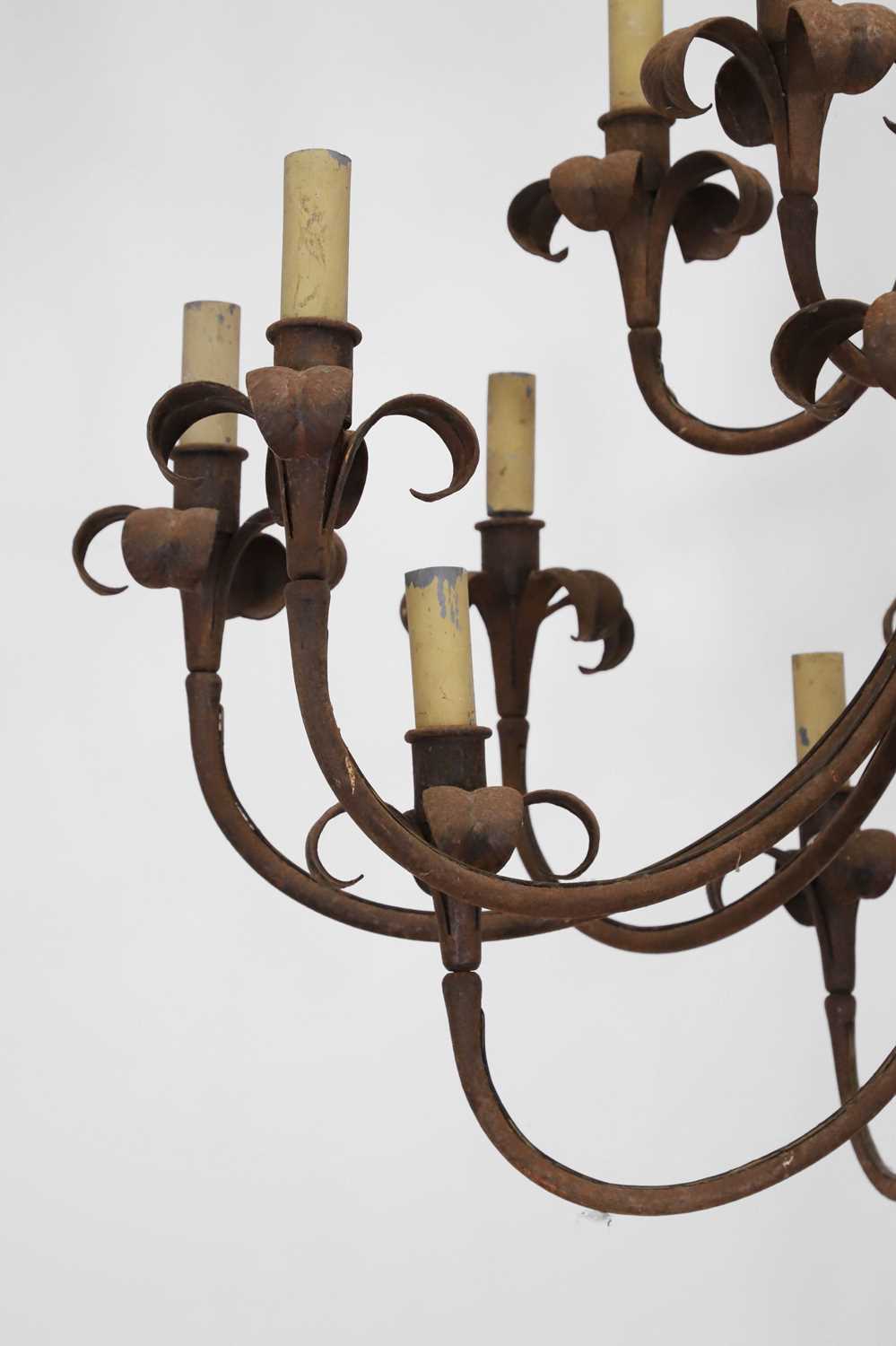 A wrought-metal sixteen-light chandelier, - Image 6 of 6