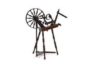 A Victorian turned fruitwood spinning wheel