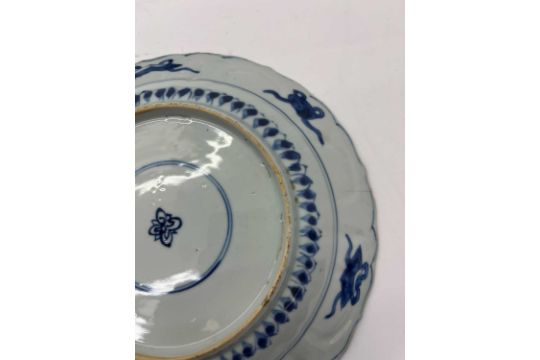 Three Chinese blue and white plates, - Image 6 of 44