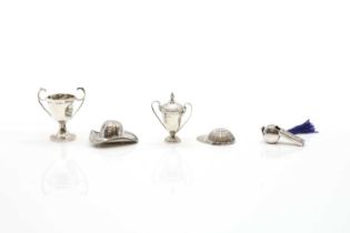 A group of silver novelty items