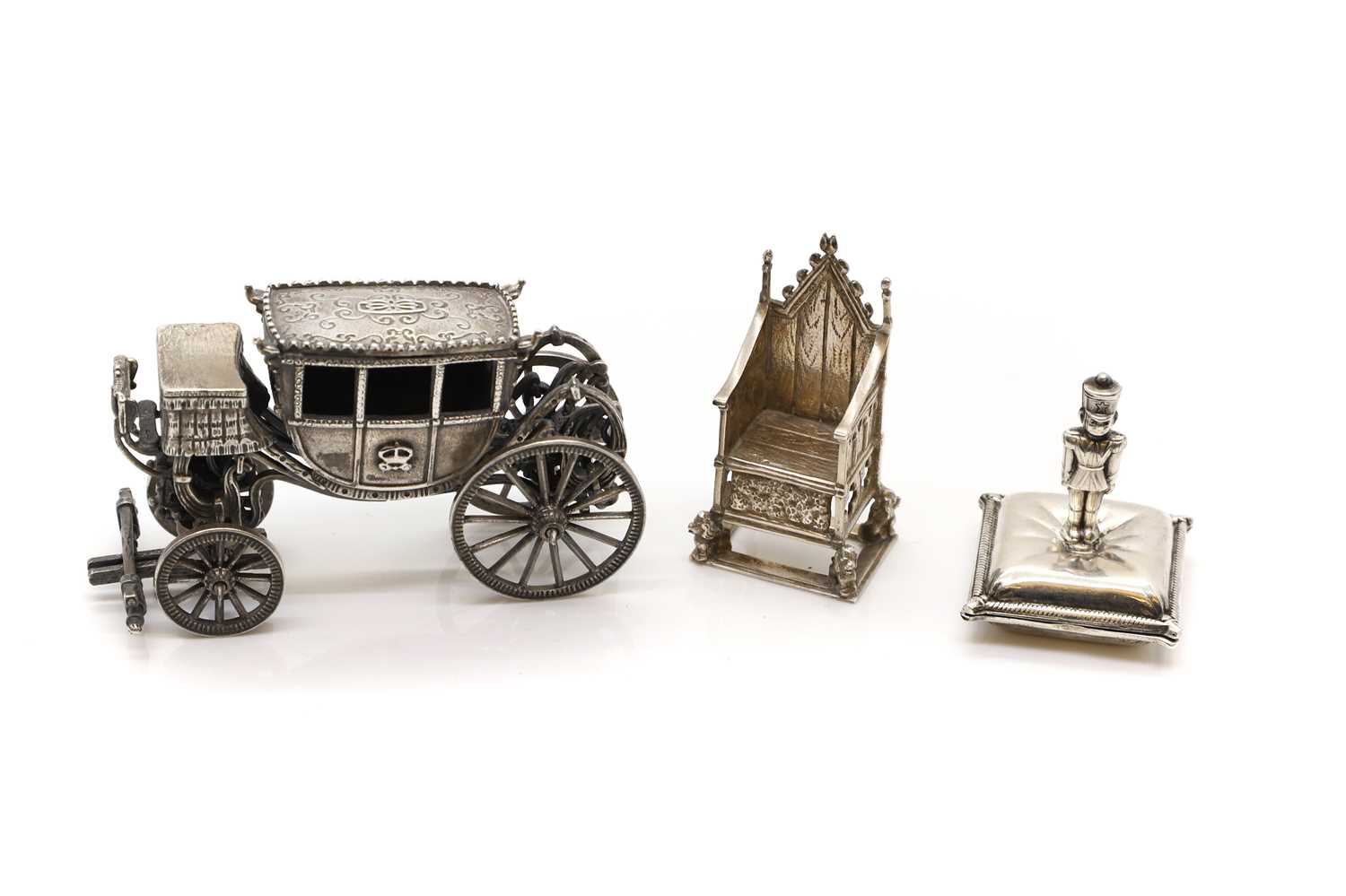 A group of three silver novelty models