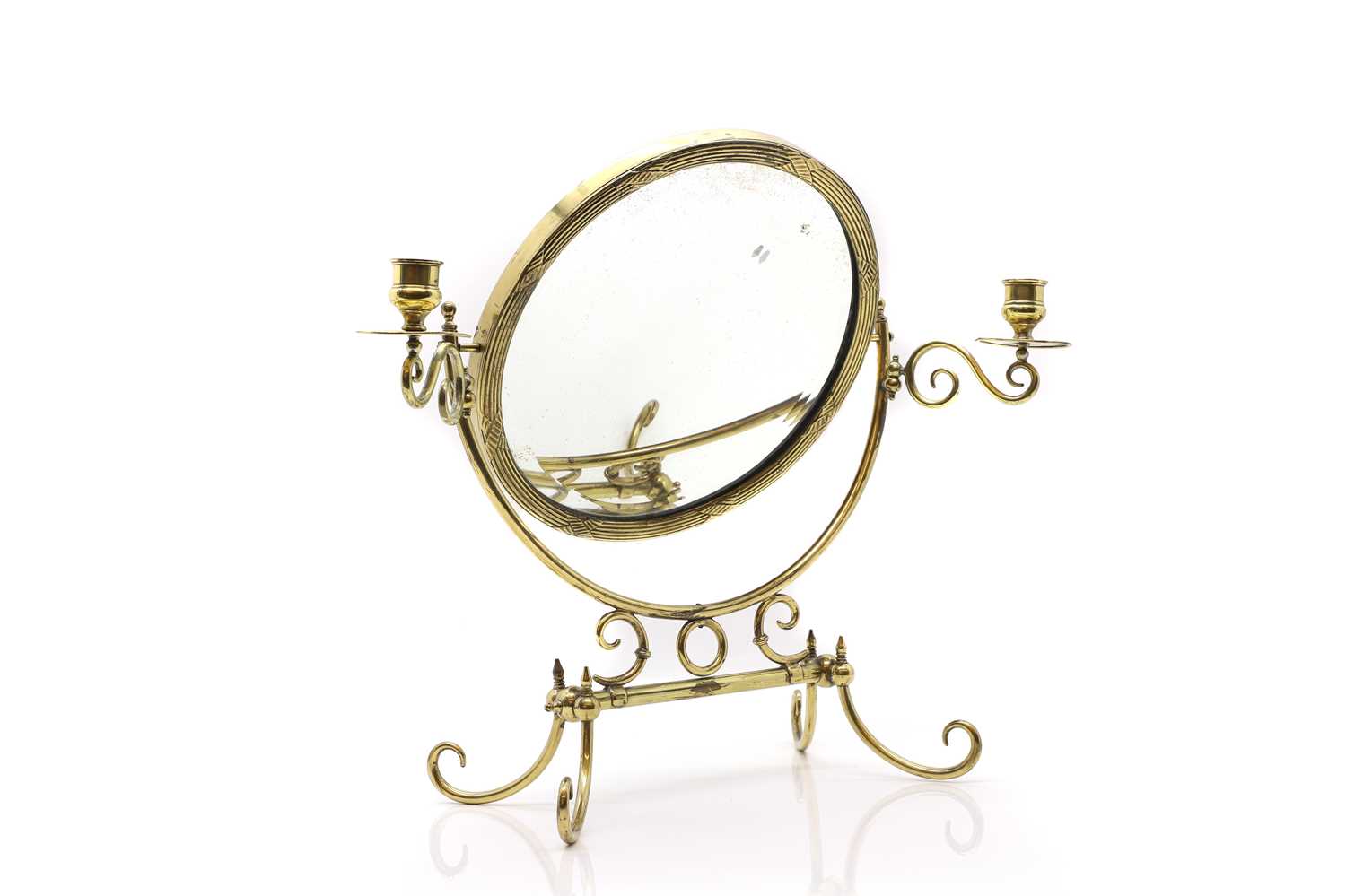 A small brass dressing table mirror,