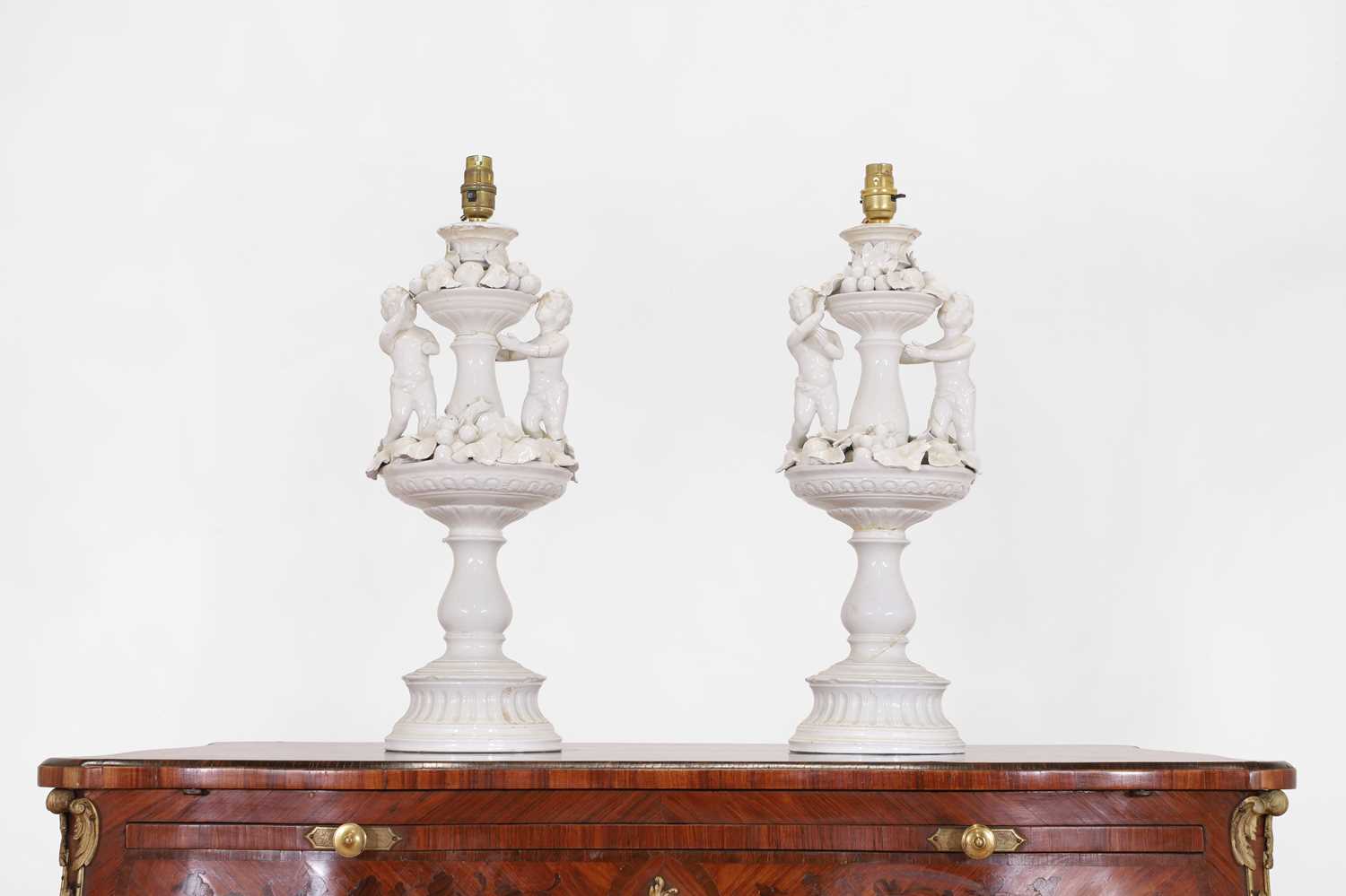 A pair of white-glazed pottery table lamps by Casa Pupo,