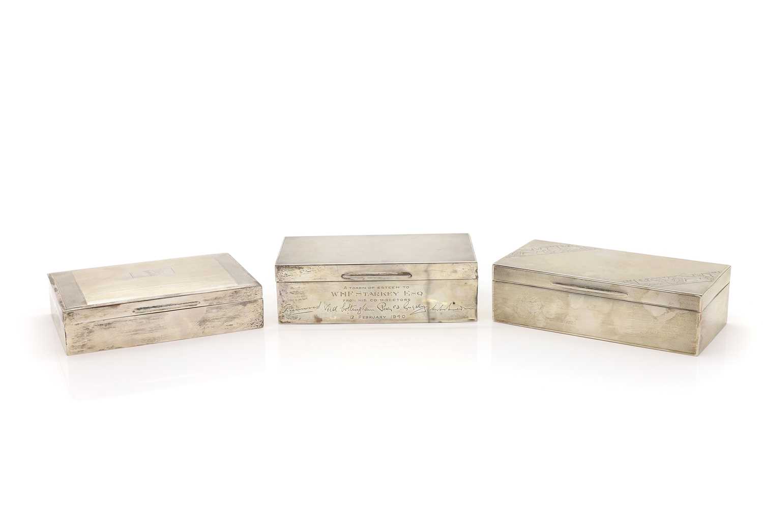 A group of three silver cigarette boxes