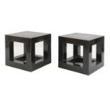 A pair of ebonised and marble inlaid side tables