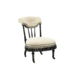 Two Victorian ebonised nursing chairs