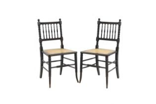 A pair of Victorian ebonised and cane chairs,