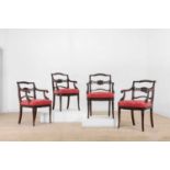 A set of four Regency-style mahogany elbow chairs,