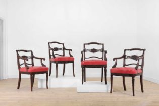 A set of four Regency-style mahogany elbow chairs,