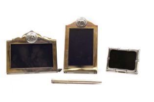 A group of three silver photograph frames