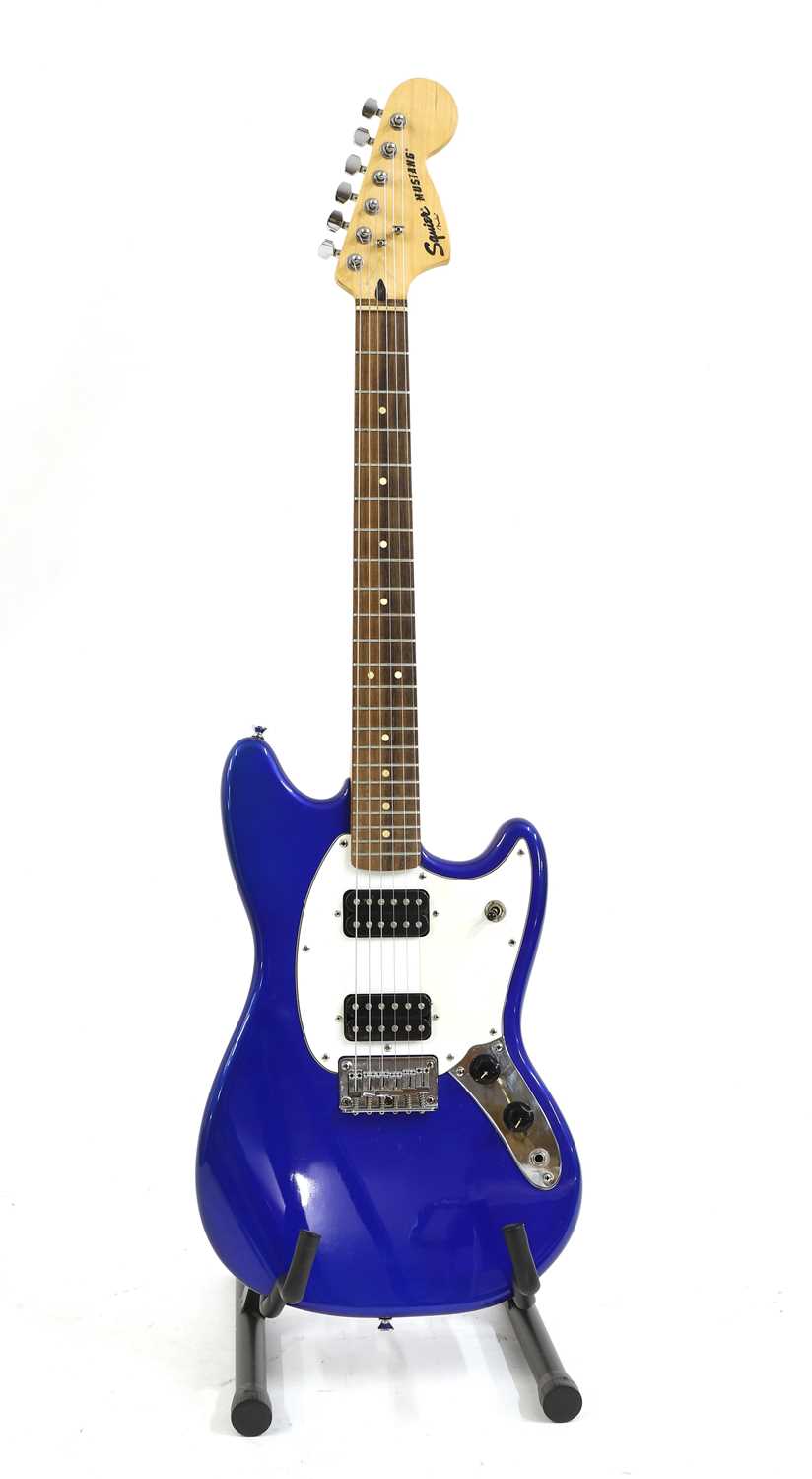 A Squire Fender Mustang electric guitar,