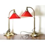 A pair of arched brass reading lamps,