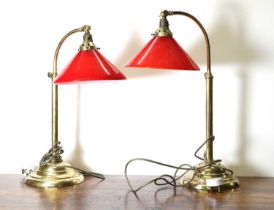 A pair of arched brass reading lamps,