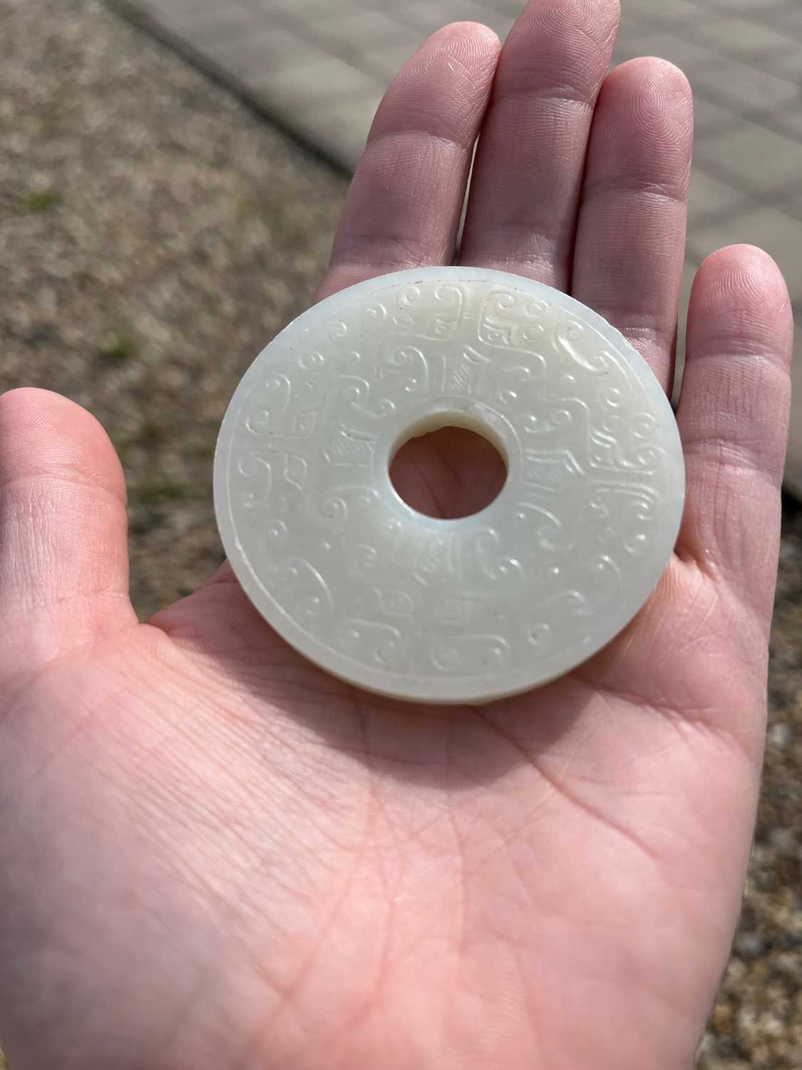A group of three Chinese jade bi disc, - Image 26 of 29