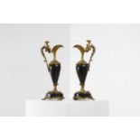A pair of Louis XV-style ormolu and black marble ewers,