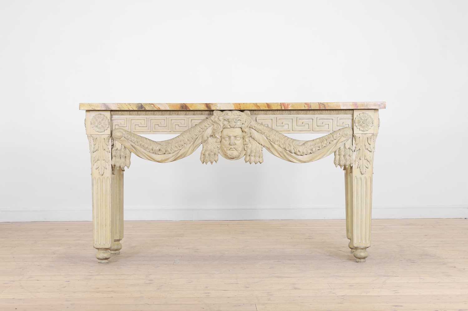A George II-style carved and painted pine console table in the manner of William Kent,