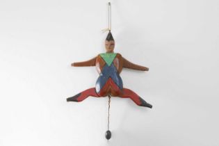 A folk art carved and painted wood 'Jumping Jack',