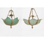 A set of three patinated-metal ceiling lights,