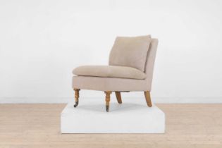 An upholstered nursing chair by OKA,