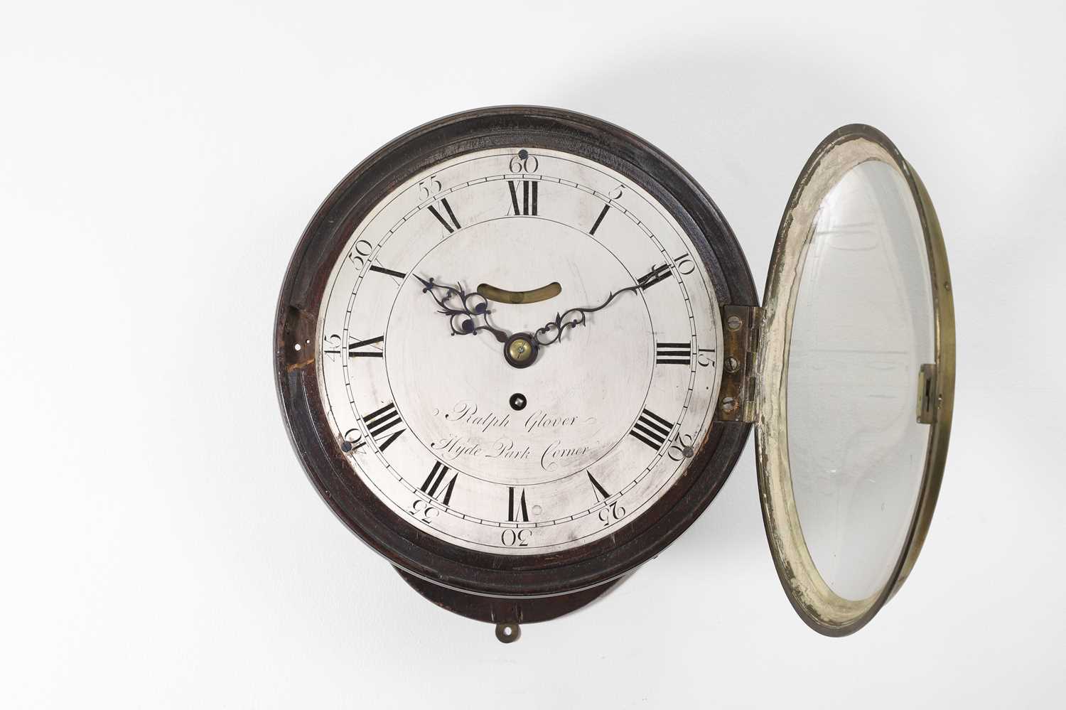 A George III circular mahogany wall clock,
