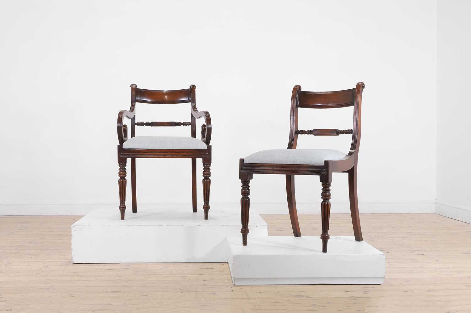 A set of fourteen William IV-style mahogany dining chairs,