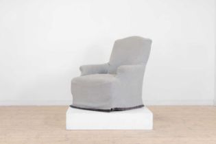 An upholstered armchair by OKA,