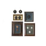 A group of six framed cameo displays,