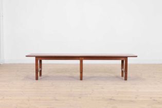 A teak coffee table by John Stuart Inc.,