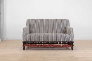 An ebonised wooden sofa by OKA,