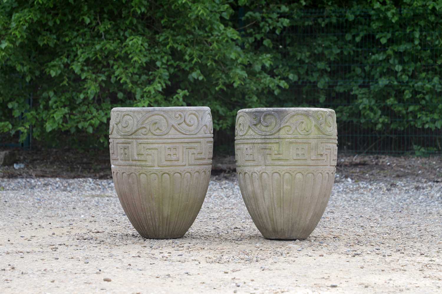 A pair of buff terracotta garden pots,