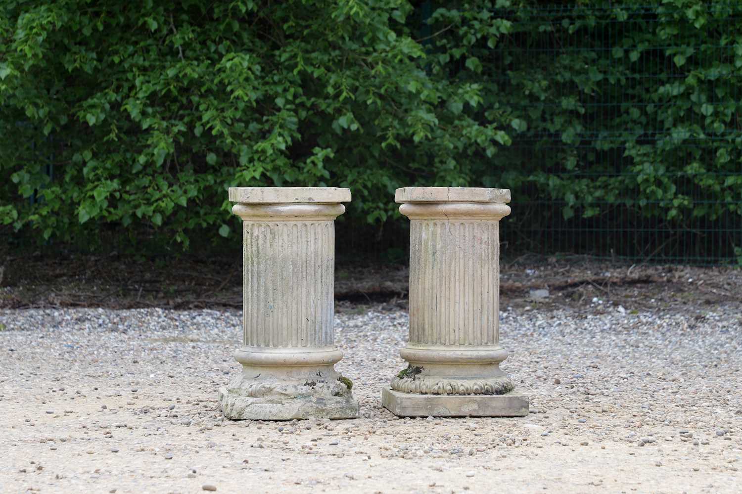 A pair of buff terracotta garden pedestals,