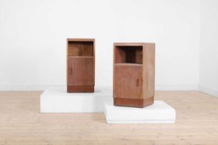 A pair of limed oak bedside cupboards,