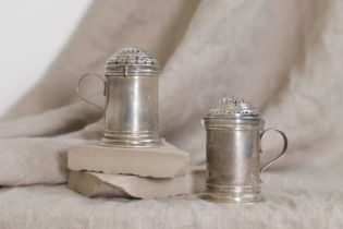 A near pair of George I silver spice dredgers or shakers,