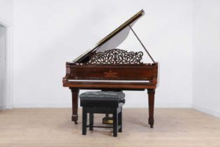 A rosewood baby grand piano by Steinway & Sons,