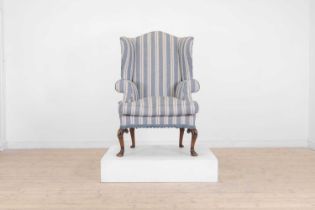 A Queen Anne-style walnut wing-back armchair,