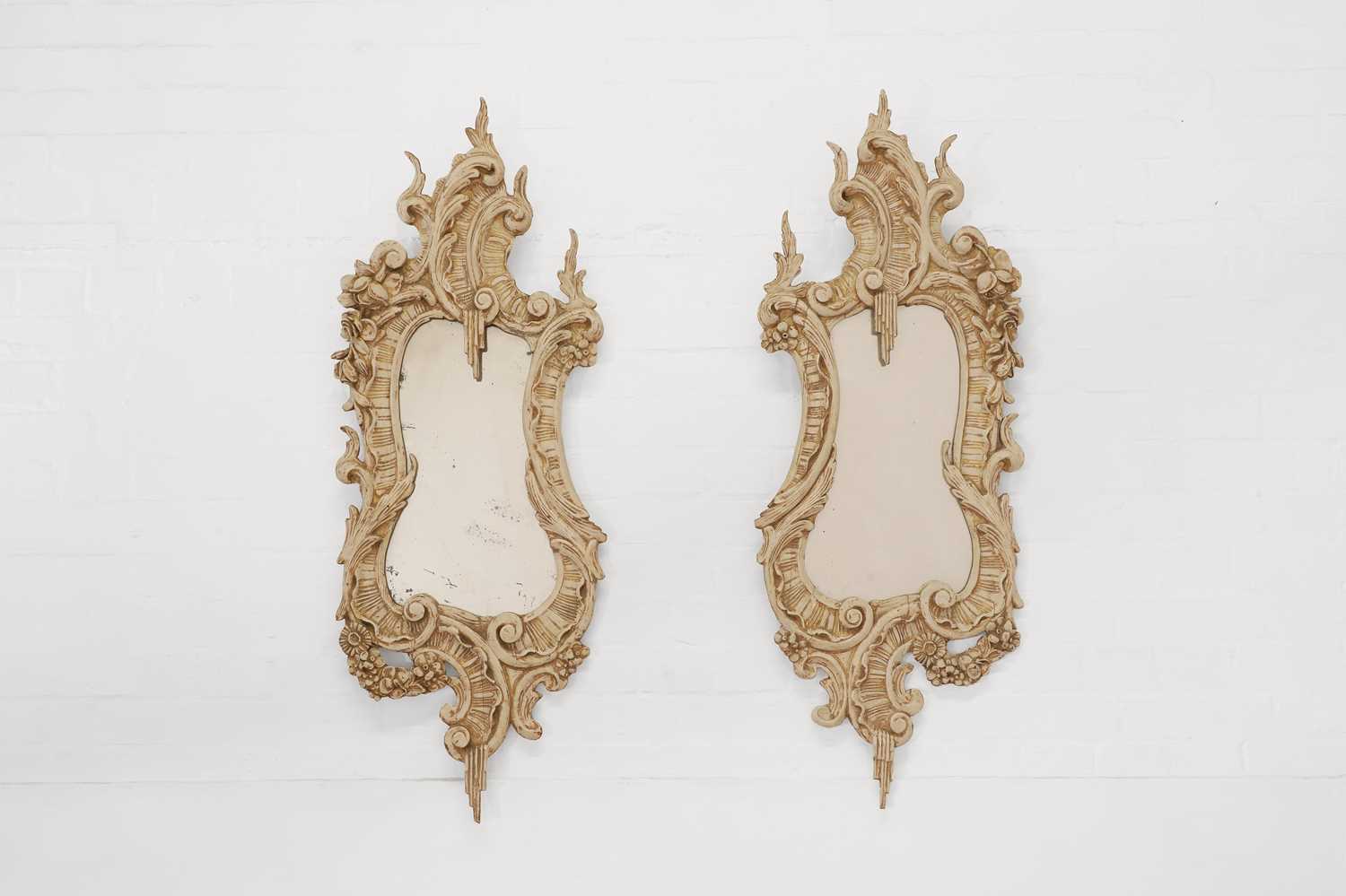 A pair of painted wooden mirrors,