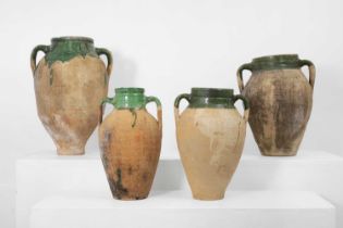 A group of four terracotta pots,