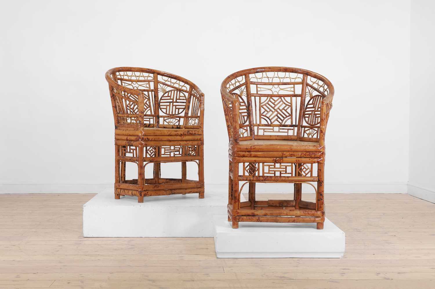 A pair of Brighton Pavilion-type bamboo elbow chairs,
