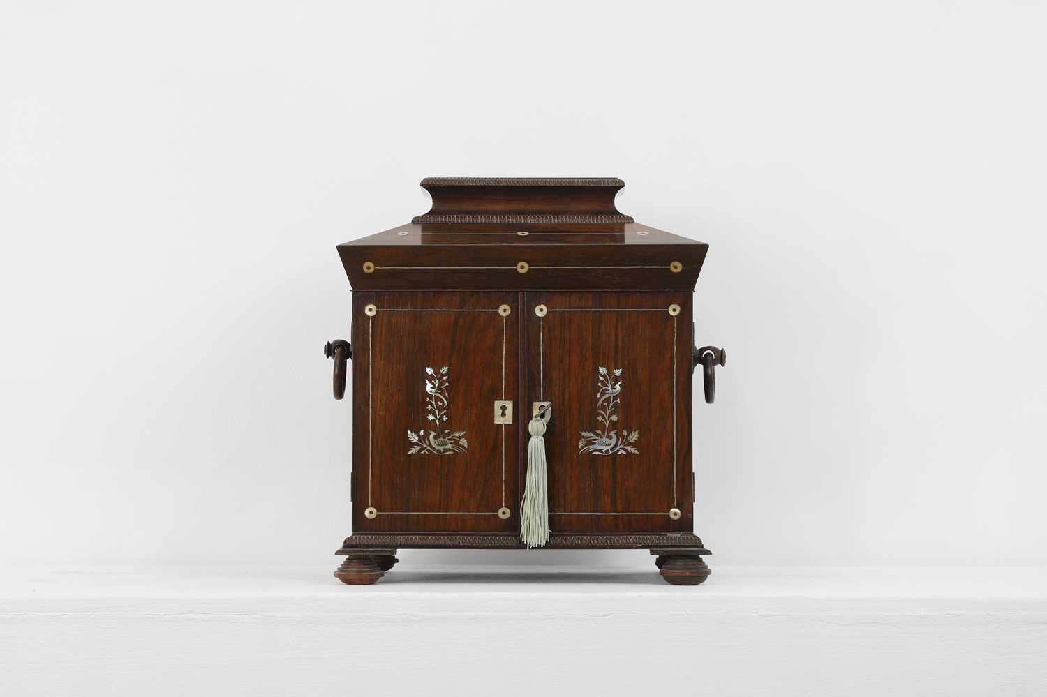 A George IV rosewood and mother-of-pearl inlaid table cabinet,