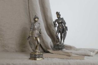 A pair of silver and ivory-mounted figures,