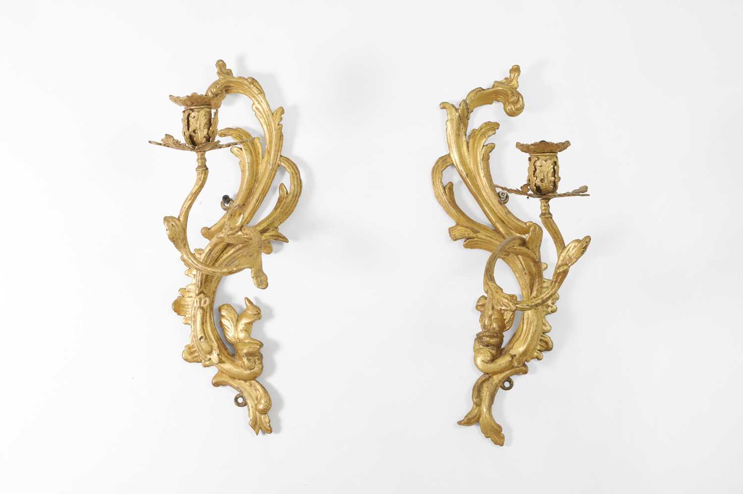 A pair of George III carved giltwood wall sconces,